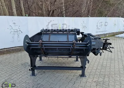 A SID spreader in operation on a farm